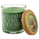 A Trim the Tree 14 oz. Candle in a Glass Holder with Cork Lid
