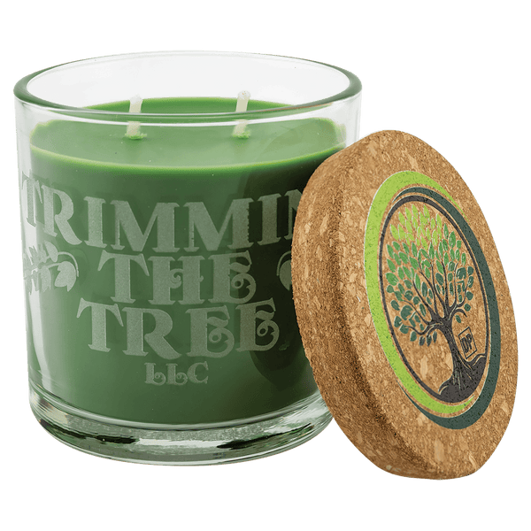 A Trim the Tree 14 oz. Candle in a Glass Holder with Cork Lid