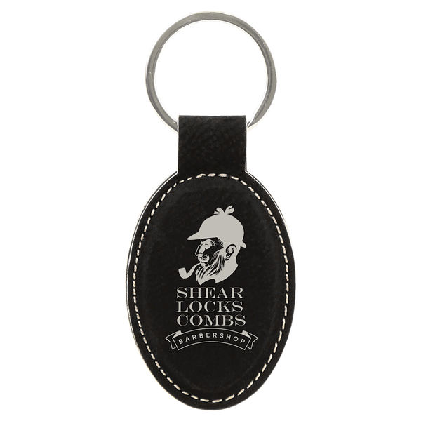 Black leather keychain with white text and logo on a white background
