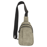 Beige textured sling bag with black zippers, a front pocket, and an adjustable black strap on a white background.