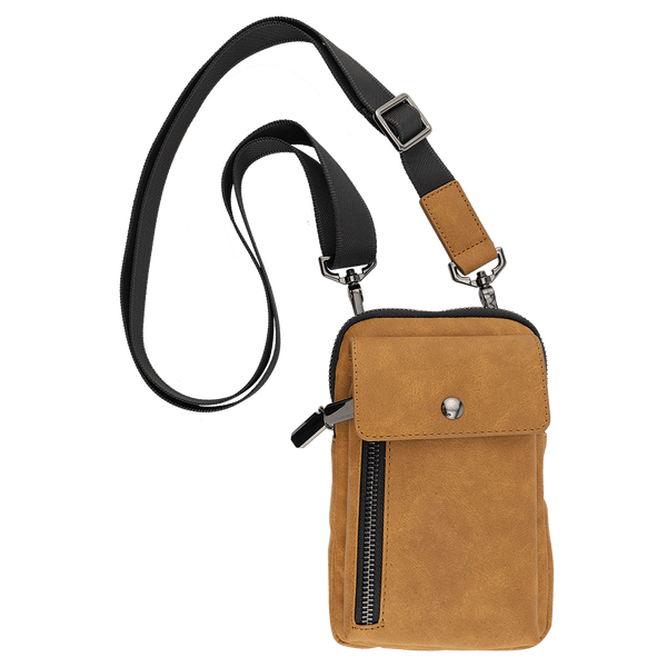 Tan crossbody bag with a black strap, a front snap flap, and a vertical zipper against a plain white background.